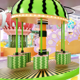 Children spinning and laughing on a watermelon-themed indoor carousel at Rainbow Playspace